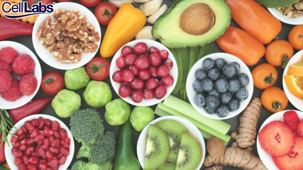 Image of cherry tomatoes, blueberries, walnuts, kiwis, avocado, bell peppers, celery, brussel sprouts, broccoly, and ginger.
